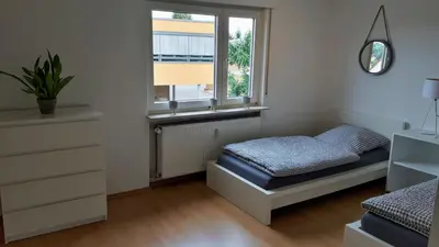 Ein Bett oder Betten in einem Zimmer der Unterkunft Ferienwohnung Weinheim Stadler