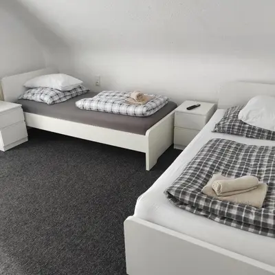 Ein Bett oder Betten in einem Zimmer der Unterkunft Klimatisiertes Ferienhaus am Bauleuteweg 25