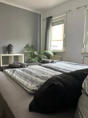 Ein Bett oder Betten in einem Zimmer der Unterkunft Ferienwohnung am Berg