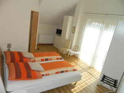 Ein Bett oder Betten in einem Zimmer der Unterkunft Gästehaus Borniger
