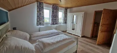 Ein Bett oder Betten in einem Zimmer der Unterkunft Ferienwohnung Friedrich
