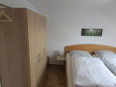 Ein Bett oder Betten in einem Zimmer der Unterkunft Gästehaus Tannenhof