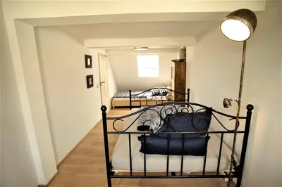 Ein Bett oder Betten in einem Zimmer der Unterkunft Ferienhaus anno 1895