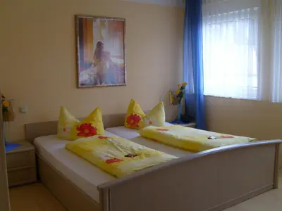 Ein Bett oder Betten in einem Zimmer der Unterkunft StadtCafé Pension