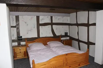 Ein Bett oder Betten in einem Zimmer der Unterkunft Eulenburg