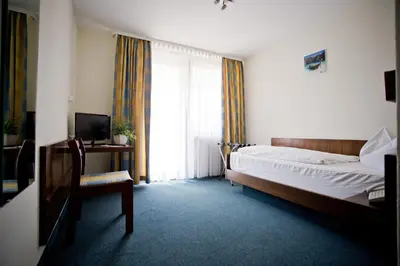 Ein Bett oder Betten in einem Zimmer der Unterkunft Hotel Lindenhof