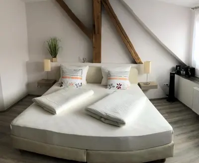 Ein Bett oder Betten in einem Zimmer der Unterkunft Altstadt-Residenz Manz