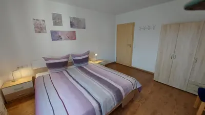 Ein Bett oder Betten in einem Zimmer der Unterkunft Ferienwohnung Bad Rappenau