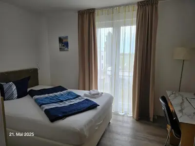Ein Bett oder Betten in einem Zimmer der Unterkunft Hotel Ackermann