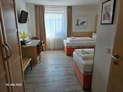 Ein Bett oder Betten in einem Zimmer der Unterkunft Hotel Ackermann