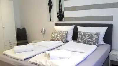 Ein Bett oder Betten in einem Zimmer der Unterkunft Villaci Business Apartments