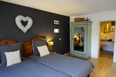 Ein Bett oder Betten in einem Zimmer der Unterkunft Ferienwohnung Korbmacher - Auszeit in der Pfalz