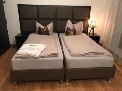 Ein Bett oder Betten in einem Zimmer der Unterkunft HARBOUR Business Apartment Karlsruhe