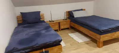 Ein Bett oder Betten in einem Zimmer der Unterkunft Ferienwohnung Trommblick - Natur Pur - Rimbach im Odenwald