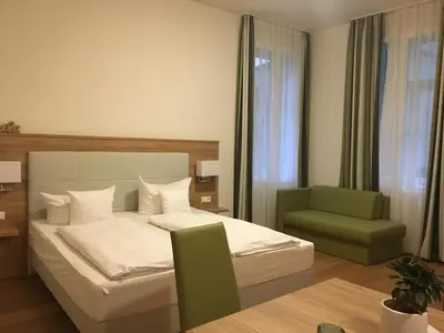 Ein Bett oder Betten in einem Zimmer der Unterkunft Perkeo Apartments