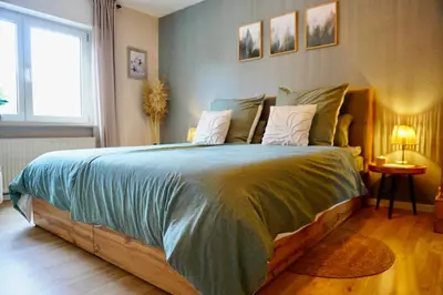 Ein Bett oder Betten in einem Zimmer der Unterkunft Ferienwohnung Küfer Wandern & Genuss in der Pfalz