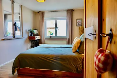 Ein Bett oder Betten in einem Zimmer der Unterkunft Ferienwohnung Küfer Wandern & Genuss in der Pfalz