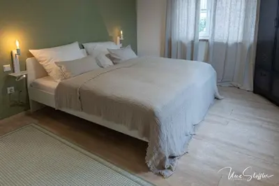 Ein Bett oder Betten in einem Zimmer der Unterkunft Sali Homes - GaesteHaus Lamm Obersulm