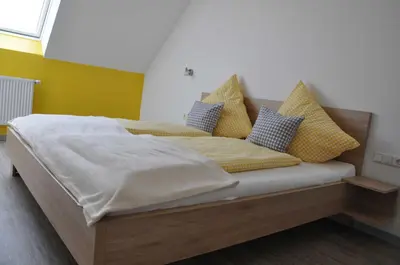 Ein Bett oder Betten in einem Zimmer der Unterkunft Ferienwohnung Vollert