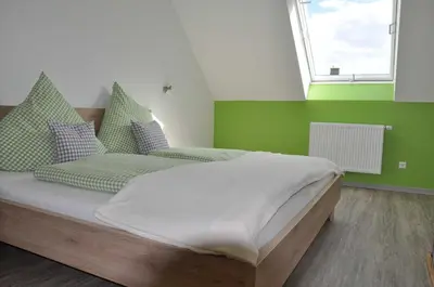 Ein Bett oder Betten in einem Zimmer der Unterkunft Ferienwohnung Vollert