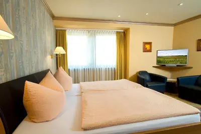 Ein Bett oder Betten in einem Zimmer der Unterkunft Gästehaus Hebinger am Schlosspark