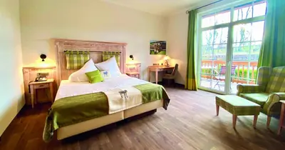 Ein Bett oder Betten in einem Zimmer der Unterkunft Hotel Sonnenhof Aspach