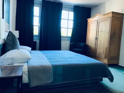 Ein Bett oder Betten in einem Zimmer der Unterkunft Hotel Mainzer Hof