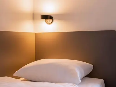 Ein Bett oder Betten in einem Zimmer der Unterkunft B&B Hotel Heidelberg