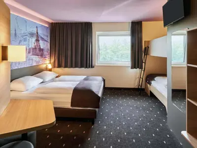 Ein Bett oder Betten in einem Zimmer der Unterkunft B&B Hotel Heidelberg