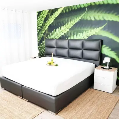 Ein Bett oder Betten in einem Zimmer der Unterkunft REBENBLÄTTLE
