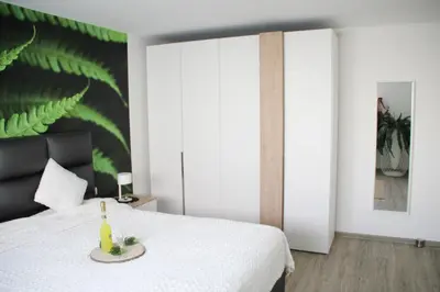 Ein Bett oder Betten in einem Zimmer der Unterkunft REBENBLÄTTLE
