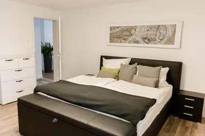 Ein Bett oder Betten in einem Zimmer der Unterkunft Brehm Living
