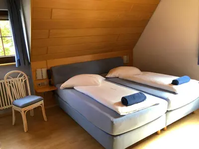 Ein Bett oder Betten in einem Zimmer der Unterkunft Gasthof zum Hirsch