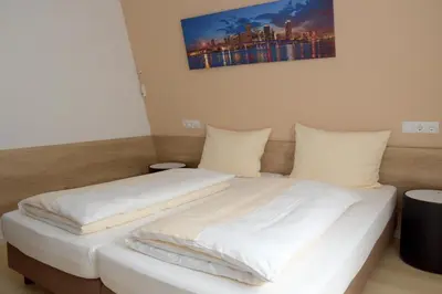 Ein Bett oder Betten in einem Zimmer der Unterkunft Hotel - Restaurant Baumann