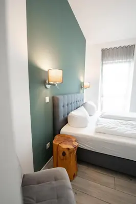 Ein Bett oder Betten in einem Zimmer der Unterkunft Prime Park Deluxe Apartment Aschaffenburg