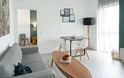 Ein Sitzbereich in der Unterkunft Prime Park Deluxe Apartment Aschaffenburg
