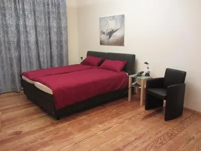 Ein Bett oder Betten in einem Zimmer der Unterkunft Exklusive Gästezimmer Landau