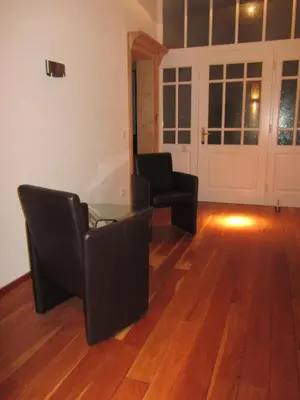 Ein Sitzbereich in der Unterkunft Exklusive Gästezimmer Landau