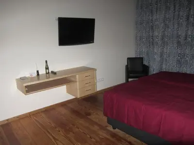 Ein Bett oder Betten in einem Zimmer der Unterkunft Exklusive Gästezimmer Landau