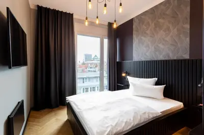 Ein Bett oder Betten in einem Zimmer der Unterkunft 133 Boutique Hotel