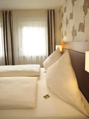 Ein Bett oder Betten in einem Zimmer der Unterkunft Hotel Nothwang
