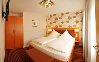 Ein Bett oder Betten in einem Zimmer der Unterkunft Hotel Nothwang