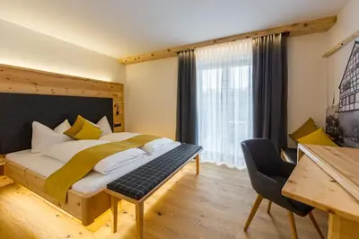Ein Bett oder Betten in einem Zimmer der Unterkunft Gästehaus Sonnenwirth