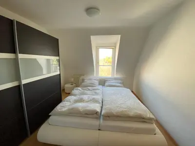 Ein Bett oder Betten in einem Zimmer der Unterkunft Ferienwohnung - Balkon, Klima, Parkplatz