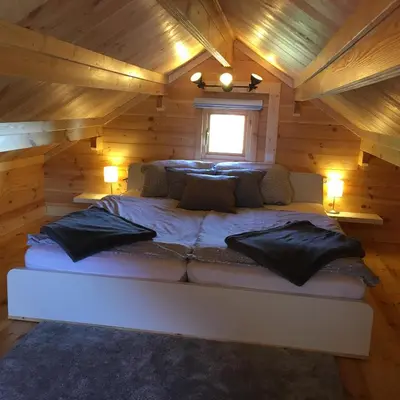 Ein Bett oder Betten in einem Zimmer der Unterkunft Ferienhaus Kleine Pfalz