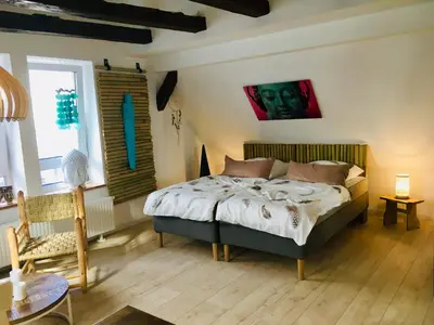 Ein Bett oder Betten in einem Zimmer der Unterkunft Freigeist Ferienwohnungen