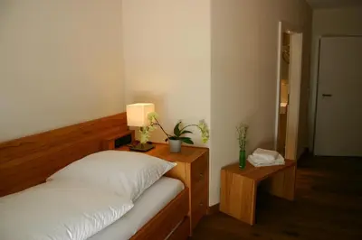 Ein Bett oder Betten in einem Zimmer der Unterkunft Rieslinghof