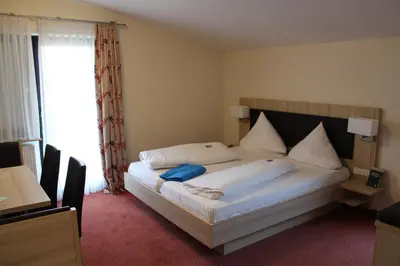 Ein Bett oder Betten in einem Zimmer der Unterkunft Villa Waldeck