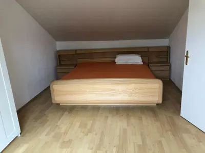 Ein Bett oder Betten in einem Zimmer der Unterkunft Ferienwohnung Heidelberg ZE-2020-7-WZ
