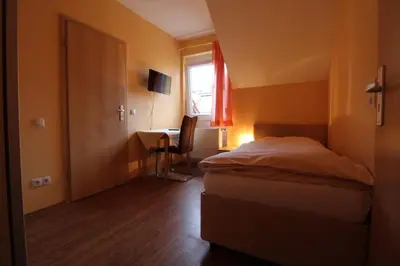 Ein Bett oder Betten in einem Zimmer der Unterkunft Gasthaus Deutsches Haus